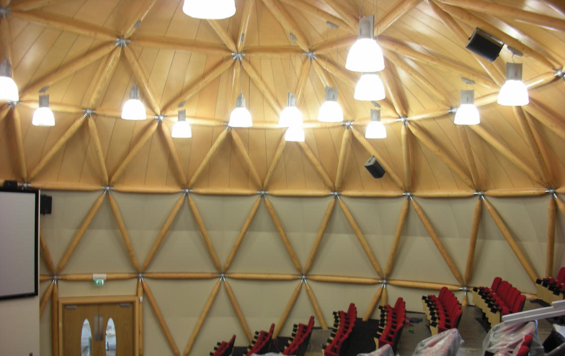 Architectural acoustic treatment integrated into a domed performance space