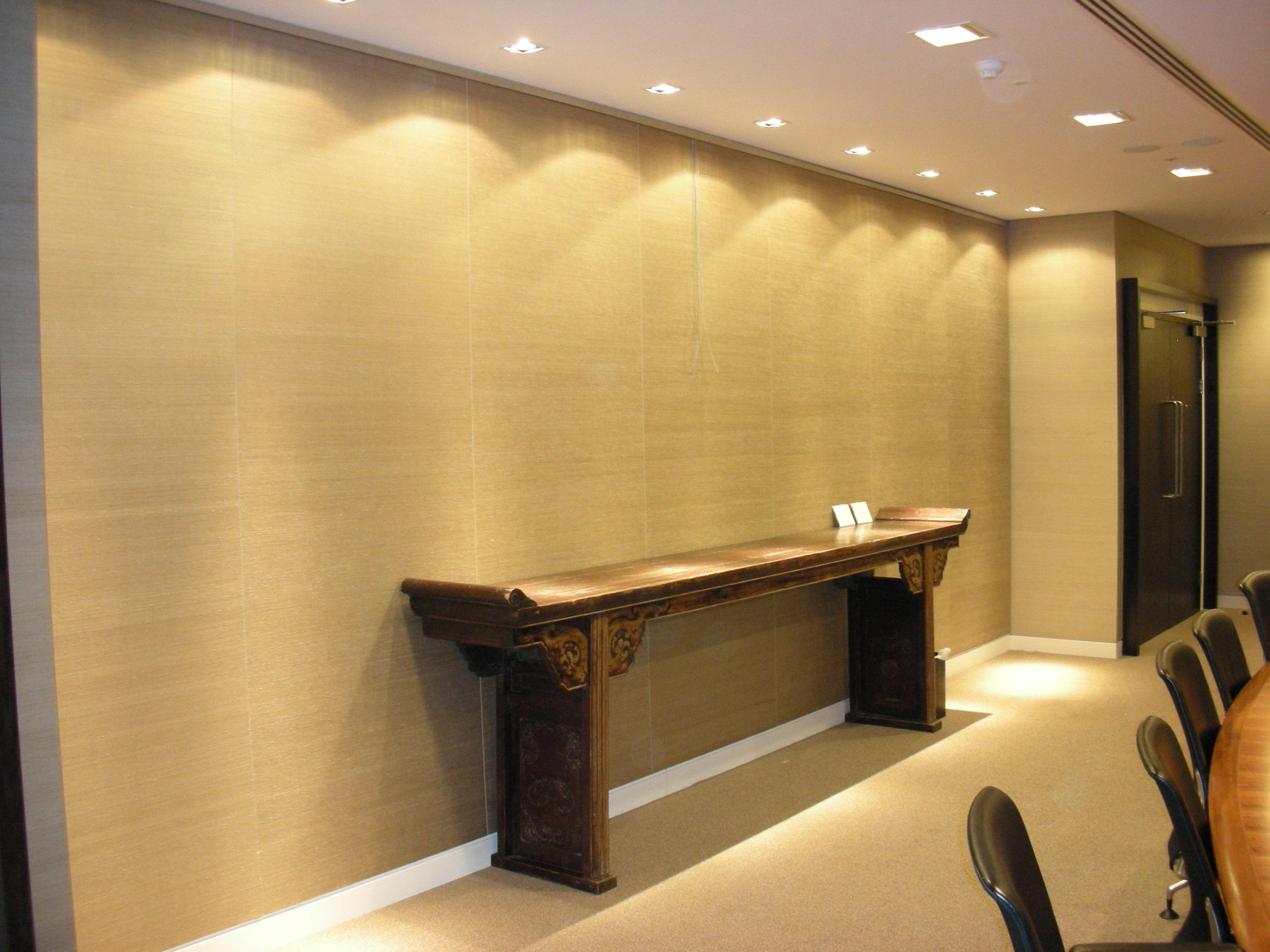 Fabric acoustic wall panels installed in a financial meeting room
