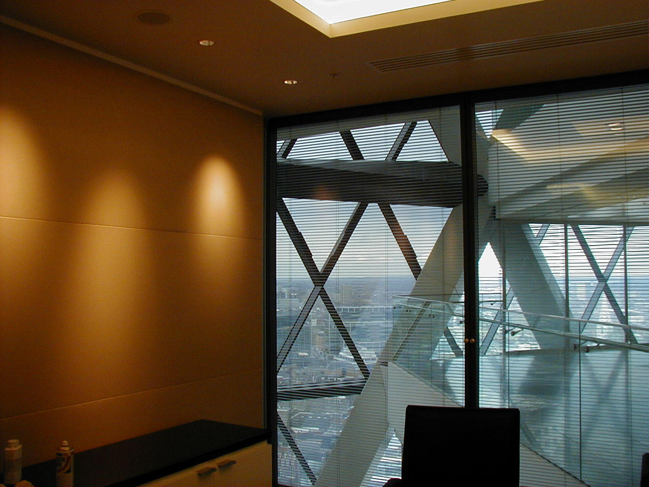 Modern interior fitted with a curved, tensioned acoustic wall surface