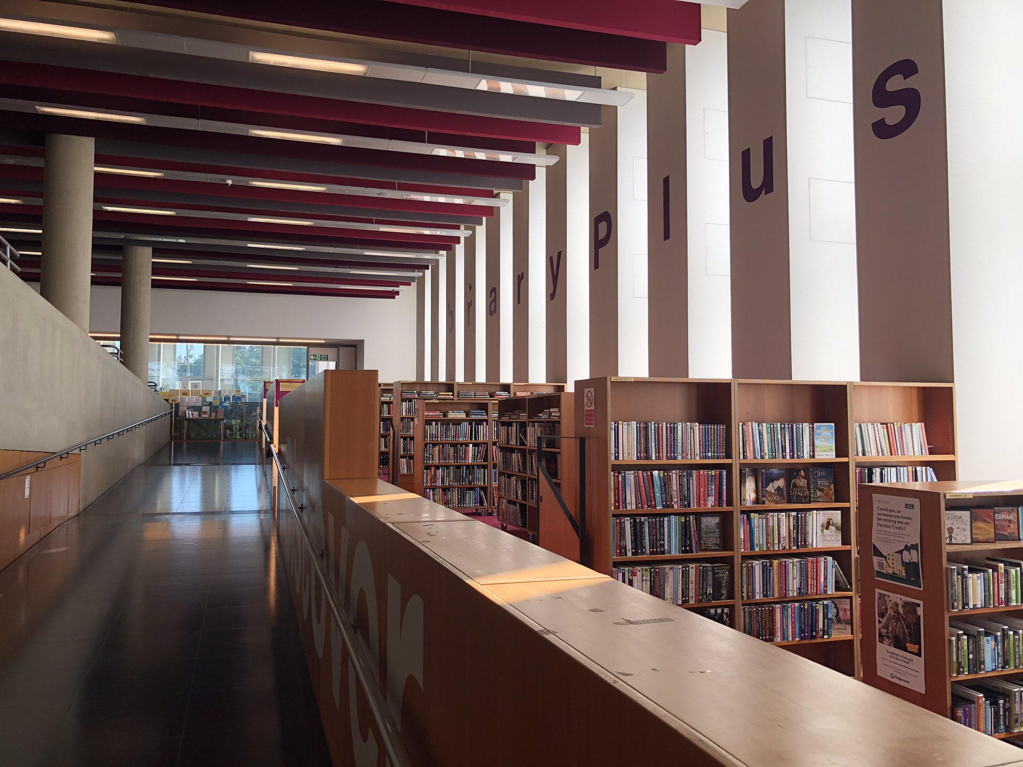 Suspended acoustic baffles installed above a library interior