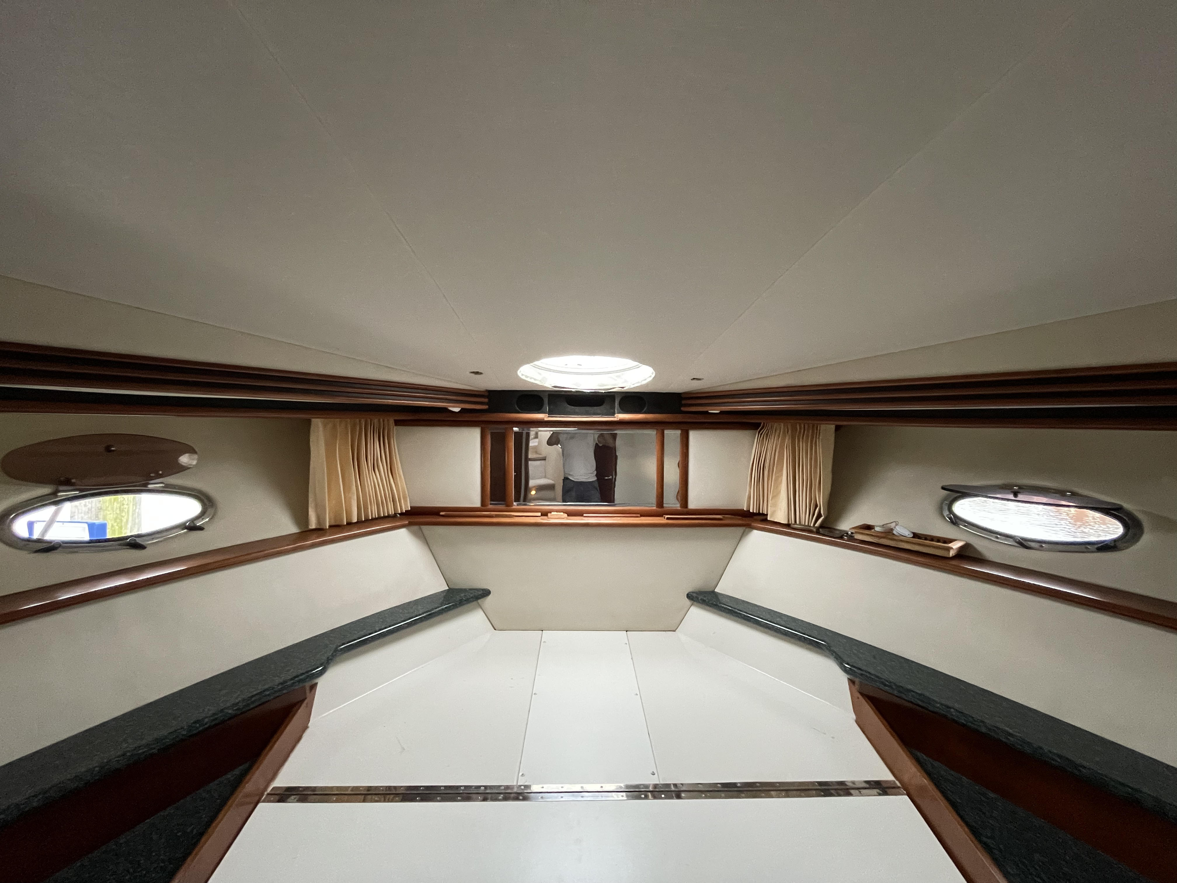 Elegant yacht lounge and entertainment area with ambient lighting and refined finishes